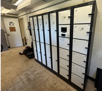 Intelligent locker system standing in front of interior wall and intelligent key control case mounted on interior wall